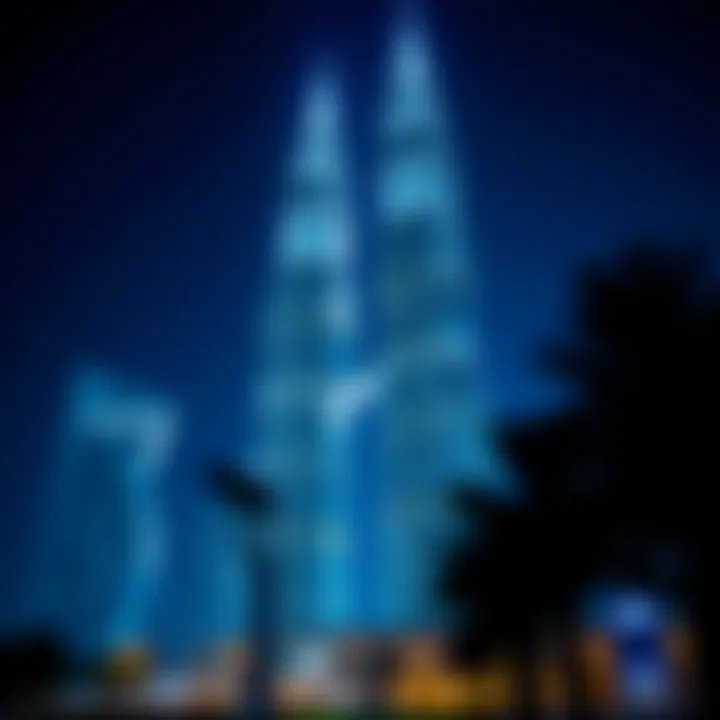 Night view of Emirates Towers illuminated, reflecting their prominence in Dubai's nightlife.